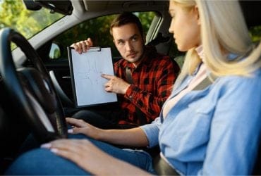 Learner driver practicing driving skills with Expert Drivers Academy instructor in Minto.